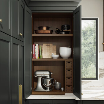 This larder cabinet features a customized baking center with a rollout shelf for a mixer, apothecary drawers & cubbies for organized kitchen storage.